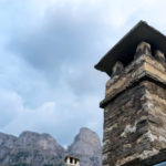 old brick chimney against rainy sky