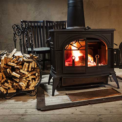 Burning wood in the stove in country house